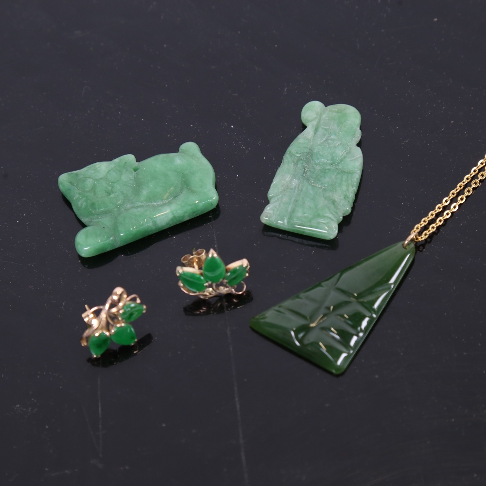 3 carved jade pendants, and a pair of unmarked gold jade stud earrings