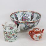 A large modern Chinese porcelain bowl, a famille rose teapot, and a Japanese teapot (3)