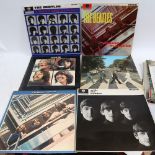 A collection of vinyl albums, including The Beatles, Rolling Stones and Pink Floyd