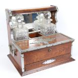 A Vintage chrome-mounted oak tantalus, with mirror-back, folding compartments and drawer, needs