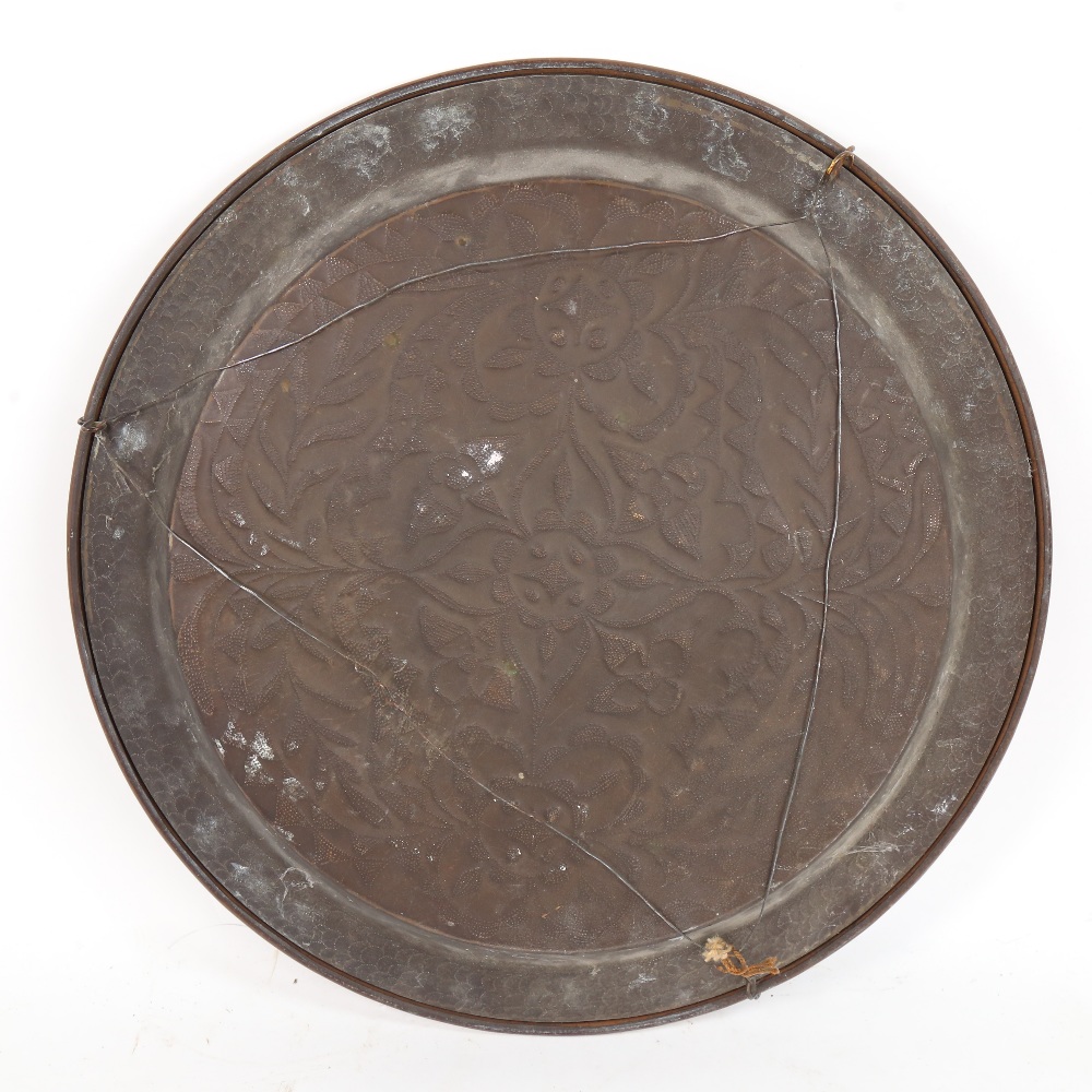 A large brass charger, relief embossed floral decoration, diameter 46cm - Image 2 of 2