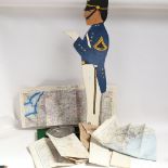 A Vintage floor standing painted wood soldier waiter figure with tray, and a canvas bag containing 8