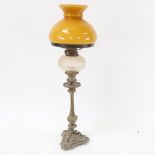 An Antique embossed brass oil lamp, with cut-glass font, height 50cm