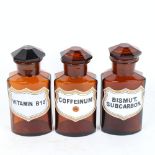 A set of 3 brown glass apothecary shop jars and stoppers, height 17cm