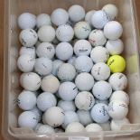 A boxful of golf balls