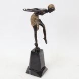 An Art Deco style painted and gilded metal dancing girl, on plinth, height 29cm