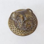 A cast-brass figural dog-head door key cover/knocker, back plate diameter 9.5cm