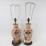 A pair of Oriental porcelain table lamps, on wooden stands, height 63cm overall