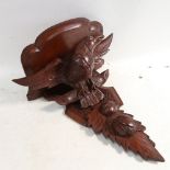 A Black Forest design carved wood wall bracket, with eagle support, height 40cm