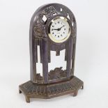 A French Art Deco silver plate on copper mantel clock, pierced geometric decoration, with modern