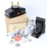 Various world coins, a Vintage folding camera, musical cabinet cigarette box etc