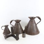 A graduated set of wine measures, a gill measure etc