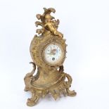 An early 20th century French gilt-brass 30-hour mantel clock, hand painted enamel dial with cherub