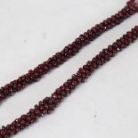 A polished garnet cluster necklace, with 9ct gold clasp, necklace length 54cm, 83.3g (A/F)