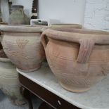 A pair of 4-handled terracotta garden pots, W45cm, H39cm