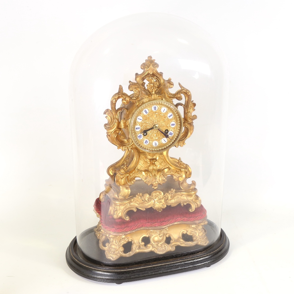 A 19th century French gilt-bronze ormolu 8-day mantel clock under glass dome, by Grohe of Paris,