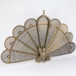 A Victorian brass peacock firescreen, H60cm