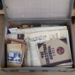 A suitcase full of ephemera, commemorative newspapers etc