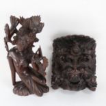 A carved hardwood Eastern dancer, 30.5cm, and a carved hardwood wall ornament