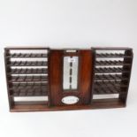 An Antique mahogany J C Cox Royal Letters patent shop counter-top postage stamp dispenser, W65cm,