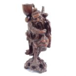 A Chinese carved rootwood lamp base in the form of a travelling man, early to mid-20th century,