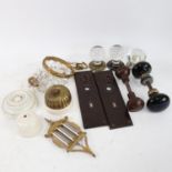 A group of Victorian glass and ceramic door knobs, a brass wall light switch, a small glass lustre