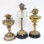 A Victorian brass twist oil lamp on plinth, with moulded glass font, height 48cm, and 2 other