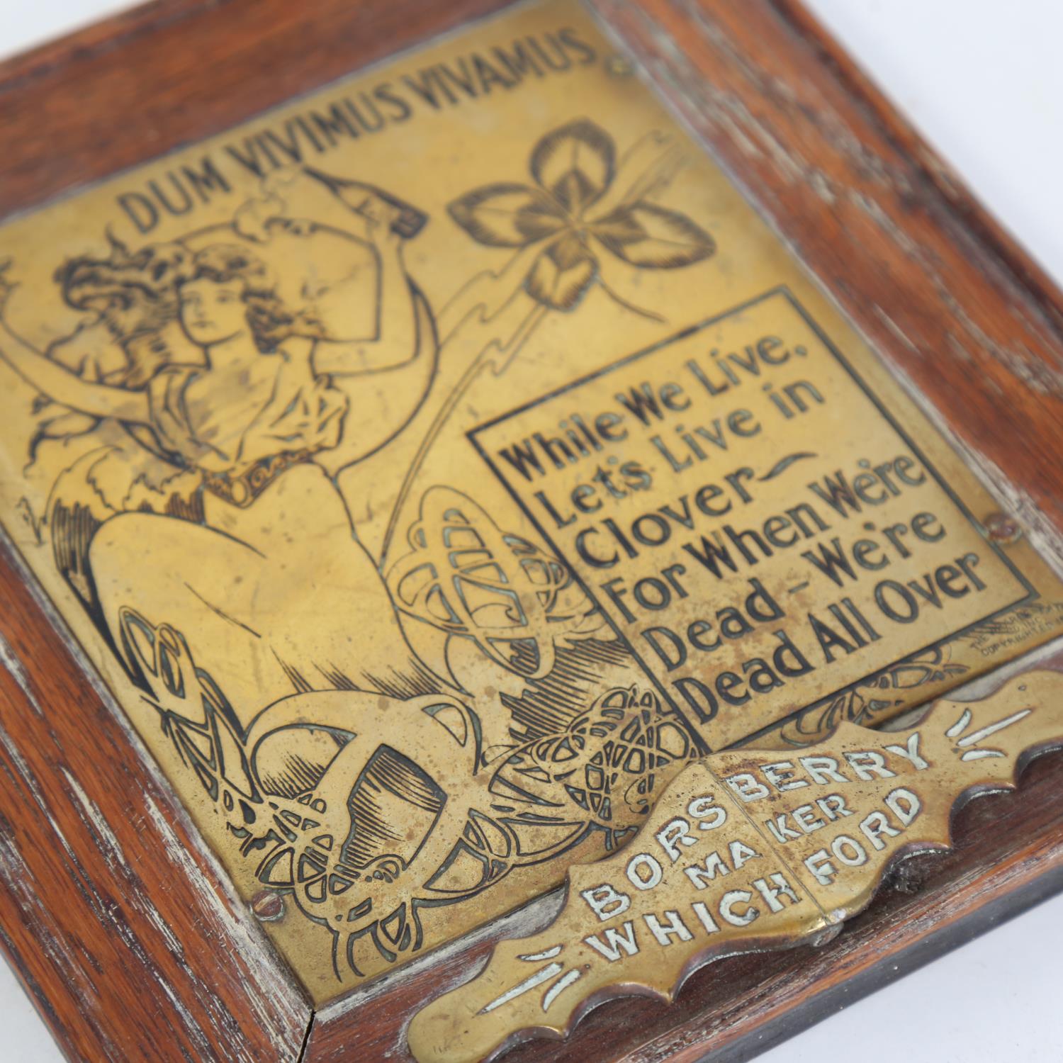 An Art Nouveau brass Dum Vivimus Vivamus plaque sign, by Borsberry of Whichford, oak-framed, overall - Image 2 of 2