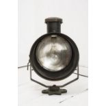 A pair of early 20th century stage lights, with mercury glass reflectors and original paint