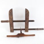 A large early wooden adjustable cramp and an Antique granny's tooth woodworking tool (2)