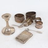 A group of silverware, to include a pair of sterling silver bangles, napkin rings, a caddy spoon,