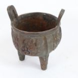 A Chinese cast-iron Archaic style Ding tripod censer, Archaic character mark on base, height 15cm,