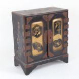 An early 20th century Japanese gilded black lacquer kodansu table-top jewellery cabinet, W18cm,