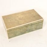 An early 20th century Art Deco shagreen and ivory cigarette box, 18cm x 11cm