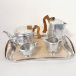 A Vintage Piquot aluminium tea service, comprising teapot, water jug, sugar bowl, cream jug and tray