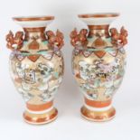 A large pair of Japanese Satsuma style porcelain baluster vases, hand painted and gilded decoration,