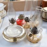 Various glass oil lamps and chimneys, tallest 46cm