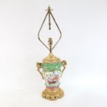 An ornate 19th century Continental porcelain and gilt-metal table lamp, with hand painted