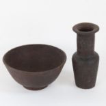 A small Antique iron footed bowl, and a similar small beaker vase, height 12cm (2)