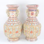 A pair of Chinese ceramic baluster vases, with glazed and enamelled decoration, with character and