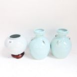 A Japanese blue glaze ceramic crane jar on stand, and a pair of blue narrow-neck vases, height