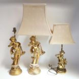 A pair of gilded plaster figural table lamps, height excluding fitting 40cm, and another similar