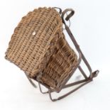 A 19th century wrought-iron framed wicker metamorphic child's bicycle seat, iron frame height 44cm