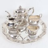 A Carrington & Company silver plated 4-piece tea set of half fluted form, and a plated serving tray