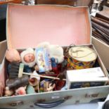 A suitcase of Vintage toys, including a drum, doll, crib etc