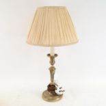 An embossed brass table lamp and shade, overall height 55cm