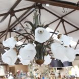 An Art Nouveau style painted metal floral spray ceiling light chandelier, with mottled glass shades,