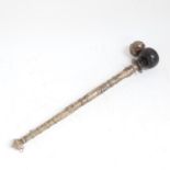 An Oriental unmarked white metal ceremonial pipe with wooden bowl, length 38cm