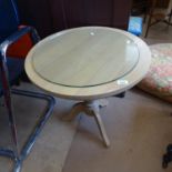 A circular oak lamp table on tripod legs, W60cm, H61cm