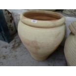 A terracotta olive oil pot, W45cm, H57cm